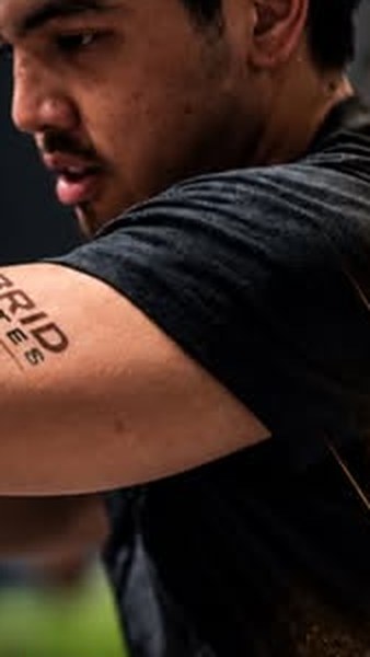 Athlete wearing a Hybrid Athletes tattoo