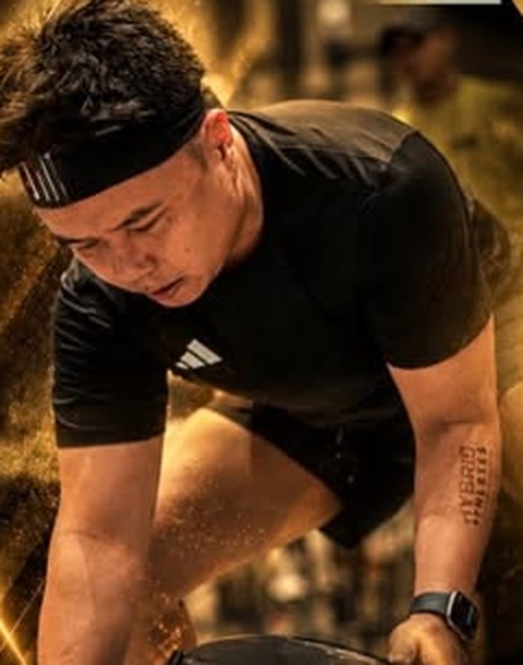 Athlete lifting a sandbag