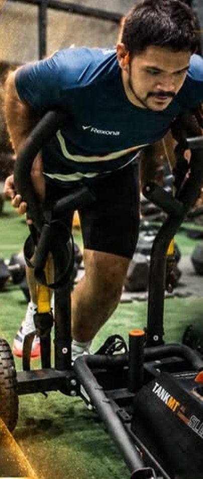 Athlete pushing a sled