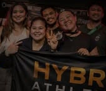 Members holding the Hybrid Athletes banner